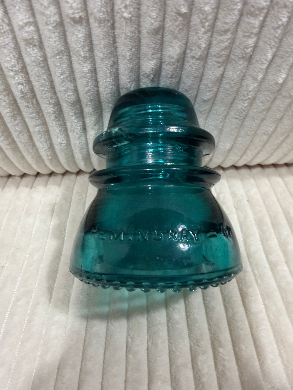 Vintage Hemingway Teal Glass Insulator - Embossed. Small flaw. See photo.